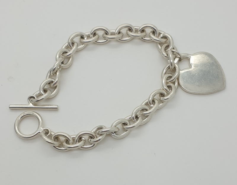 Silver belcher bracelet with heart drop